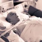 Clinical bedside swallow exam with tracheostomy and ventilator dependent patient